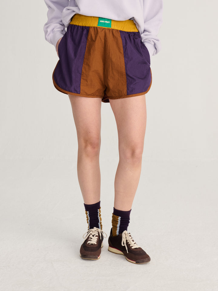 Shiny color block nylon shorts